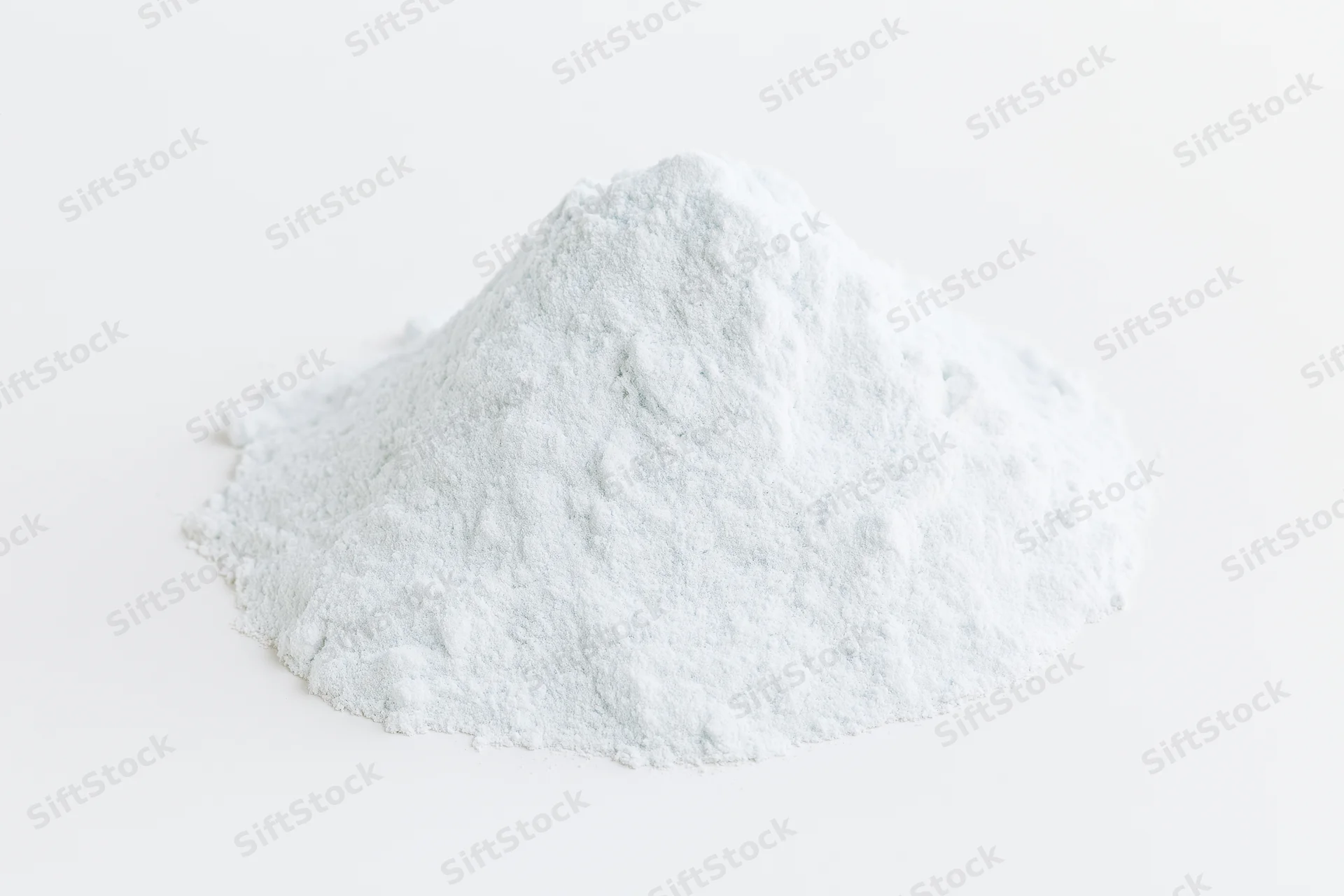 Mound of white powder on plain white surface