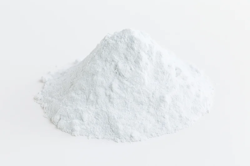 Mound of white powder on plain white surface