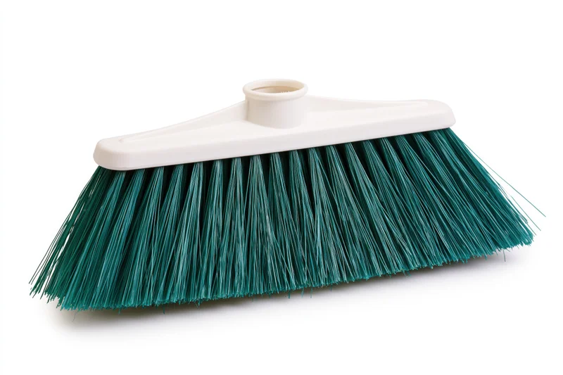 Plastic broom head with teal-green synthetic bristles isolated on white background