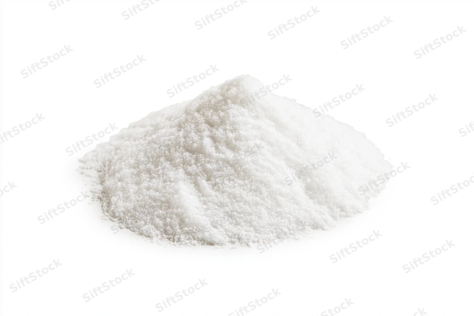 Mound of fine white granular salt isolated on white background