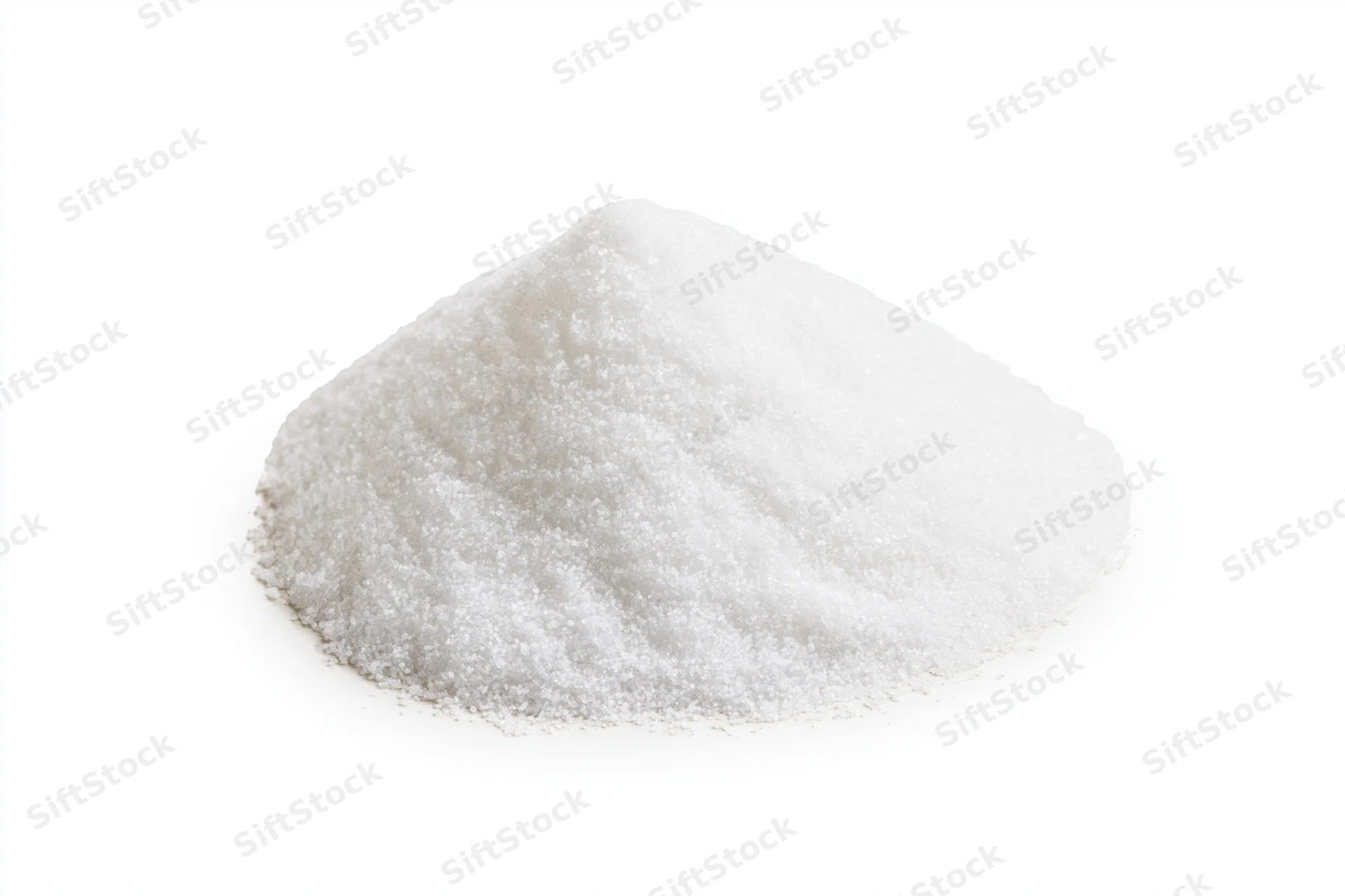 Mound of fine white granular salt isolated on white background