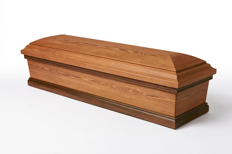 Wooden coffin with closed lid angled three-quarter view isolated on white background