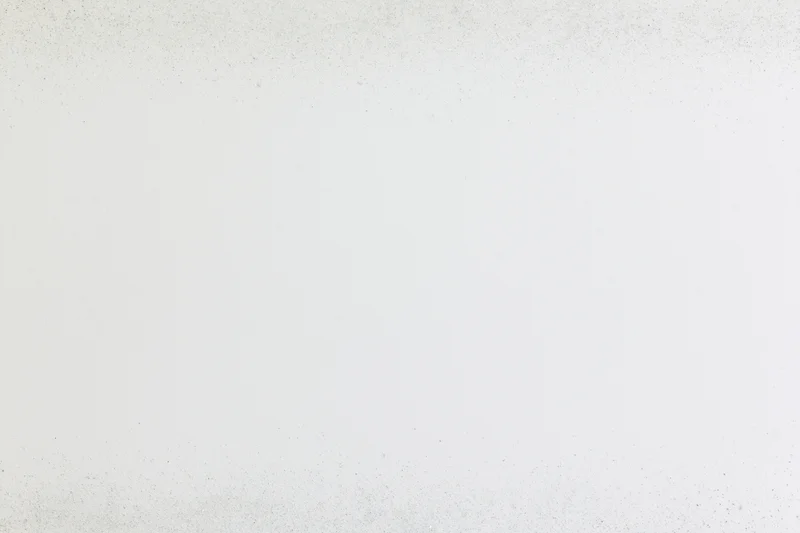 White paper texture with faint grey speckles across the surface