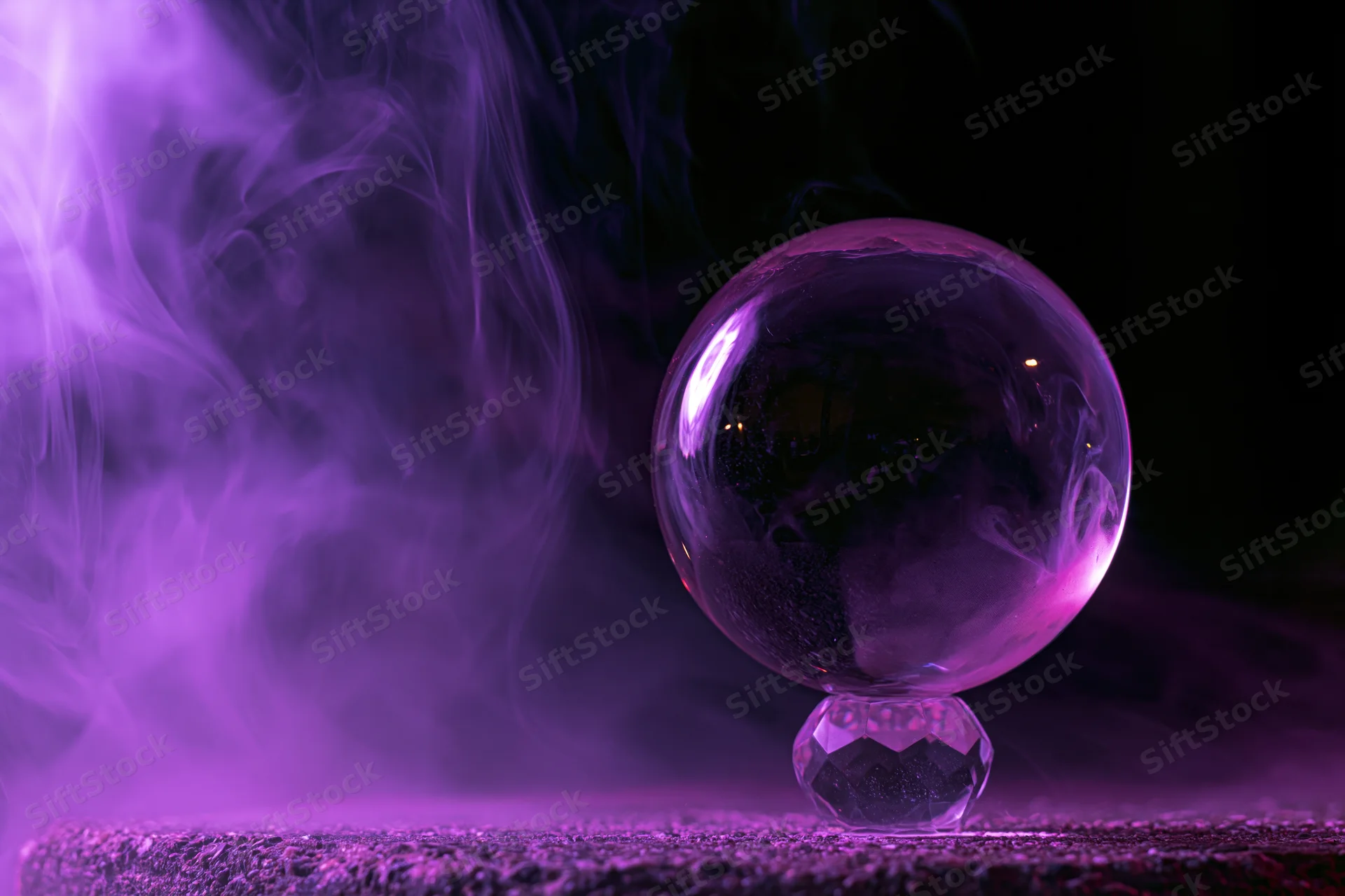 Crystal ball resting on a faceted base surrounded by purple smoke in a dark setting
