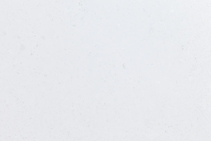 Close-up of white concrete surface with speckled texture for flat lay design
