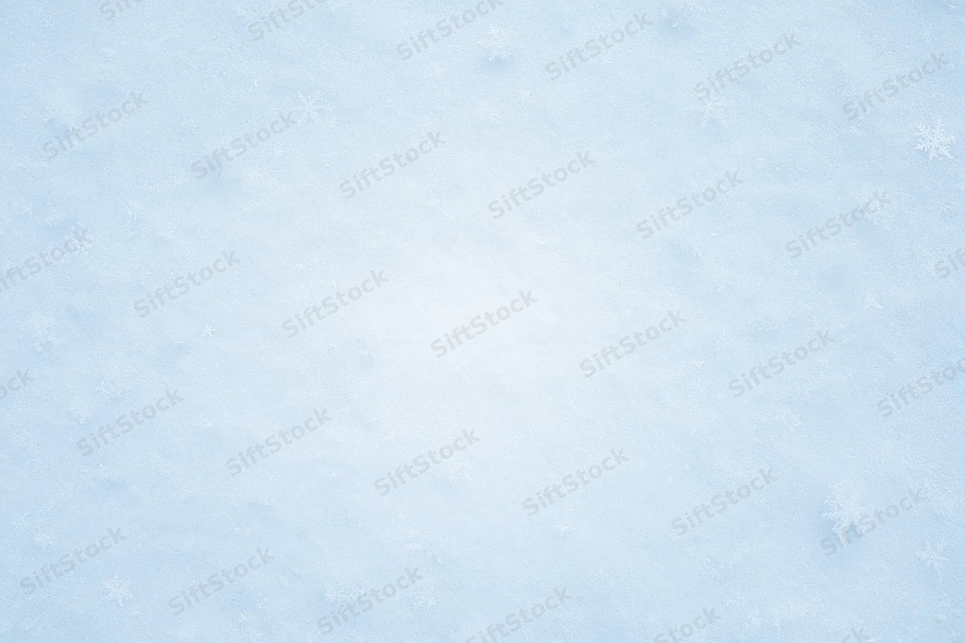 Close-up of fresh snow surface with scattered snowflakes in winter