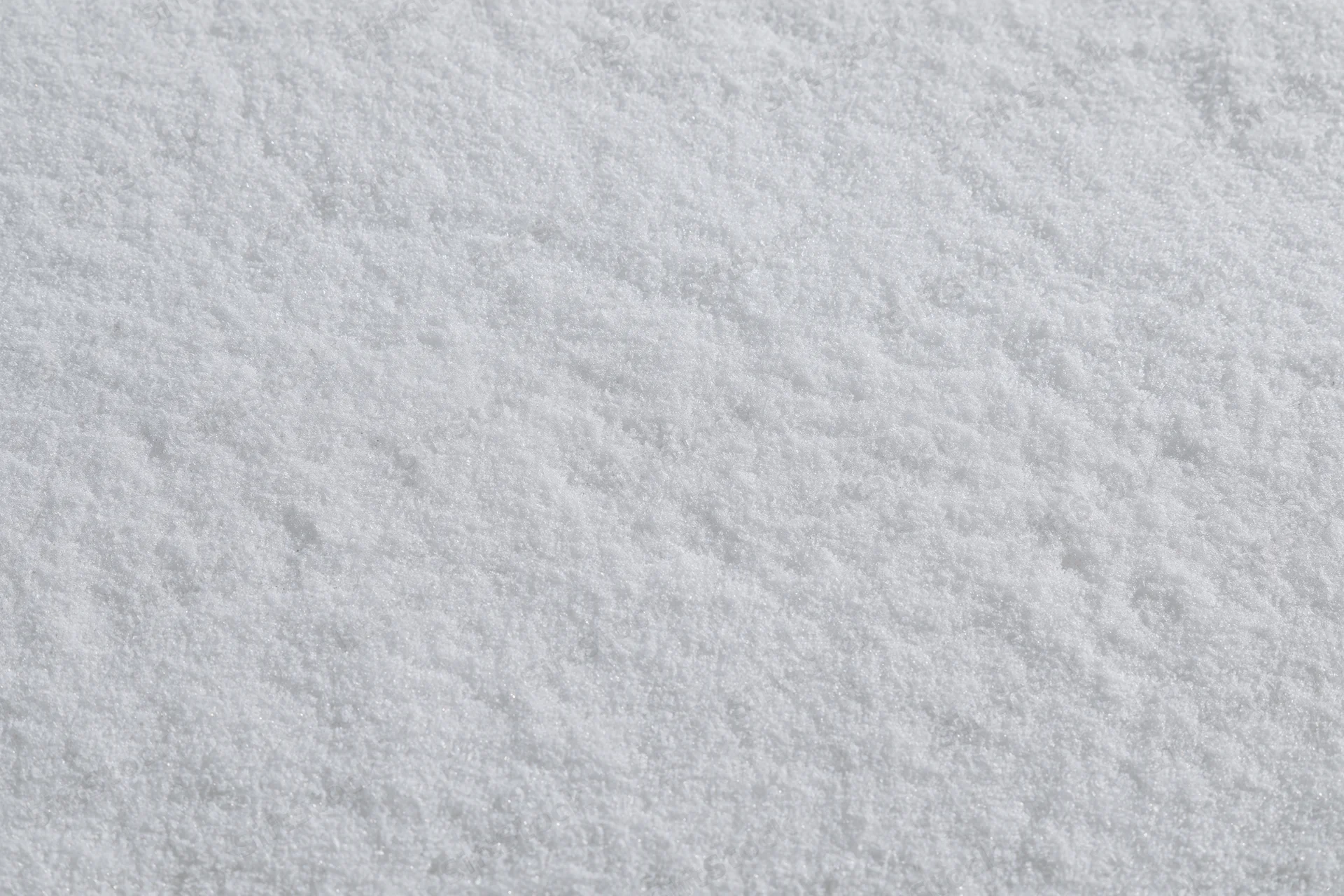 Close-up of fresh undisturbed snow surface filling the frame
