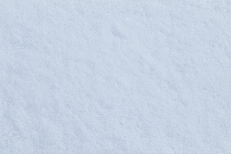 Close-up of fresh undisturbed snow surface in winter outdoors