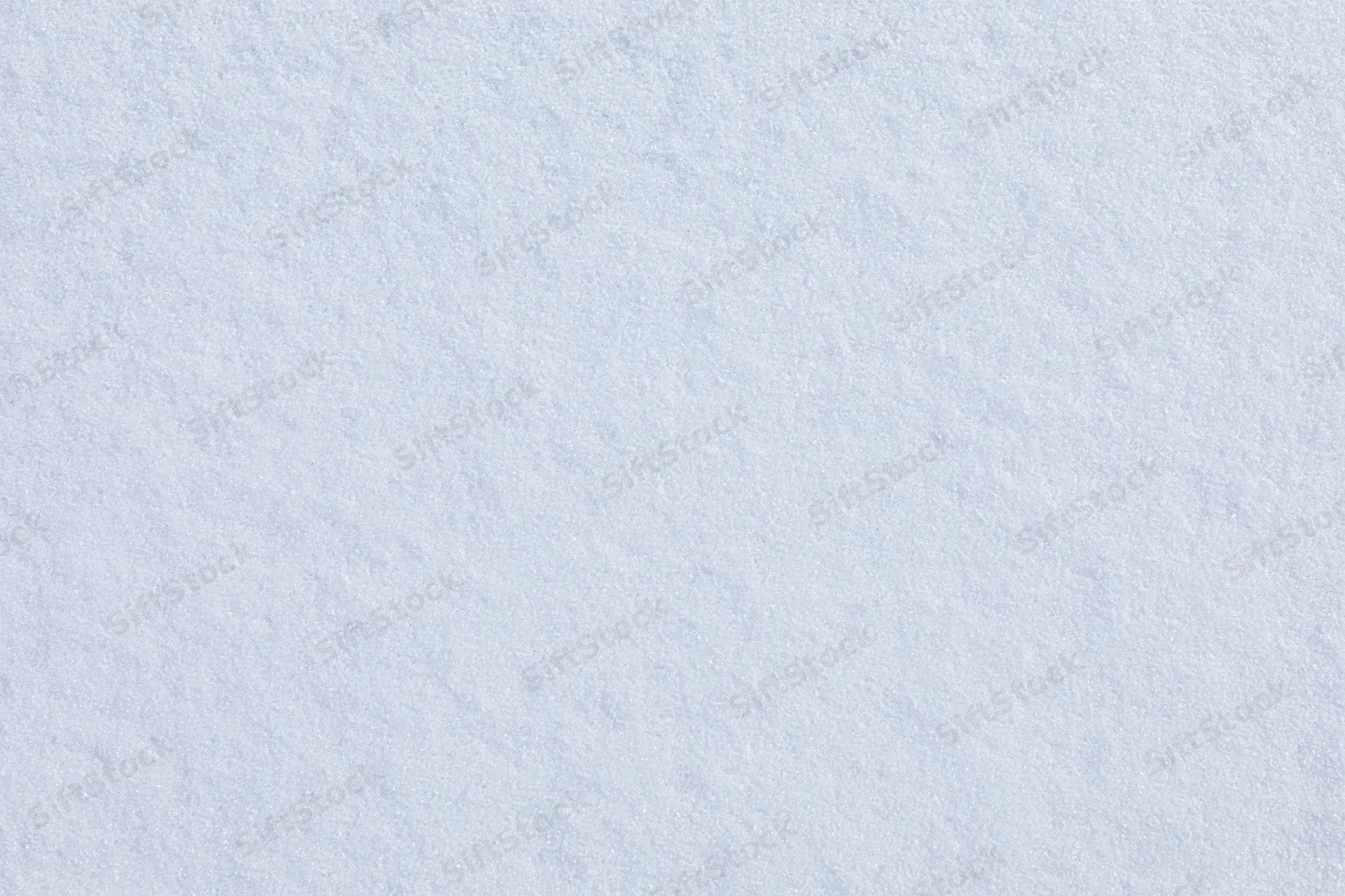 Close-up flat lay of undisturbed fresh snow surface filling the frame