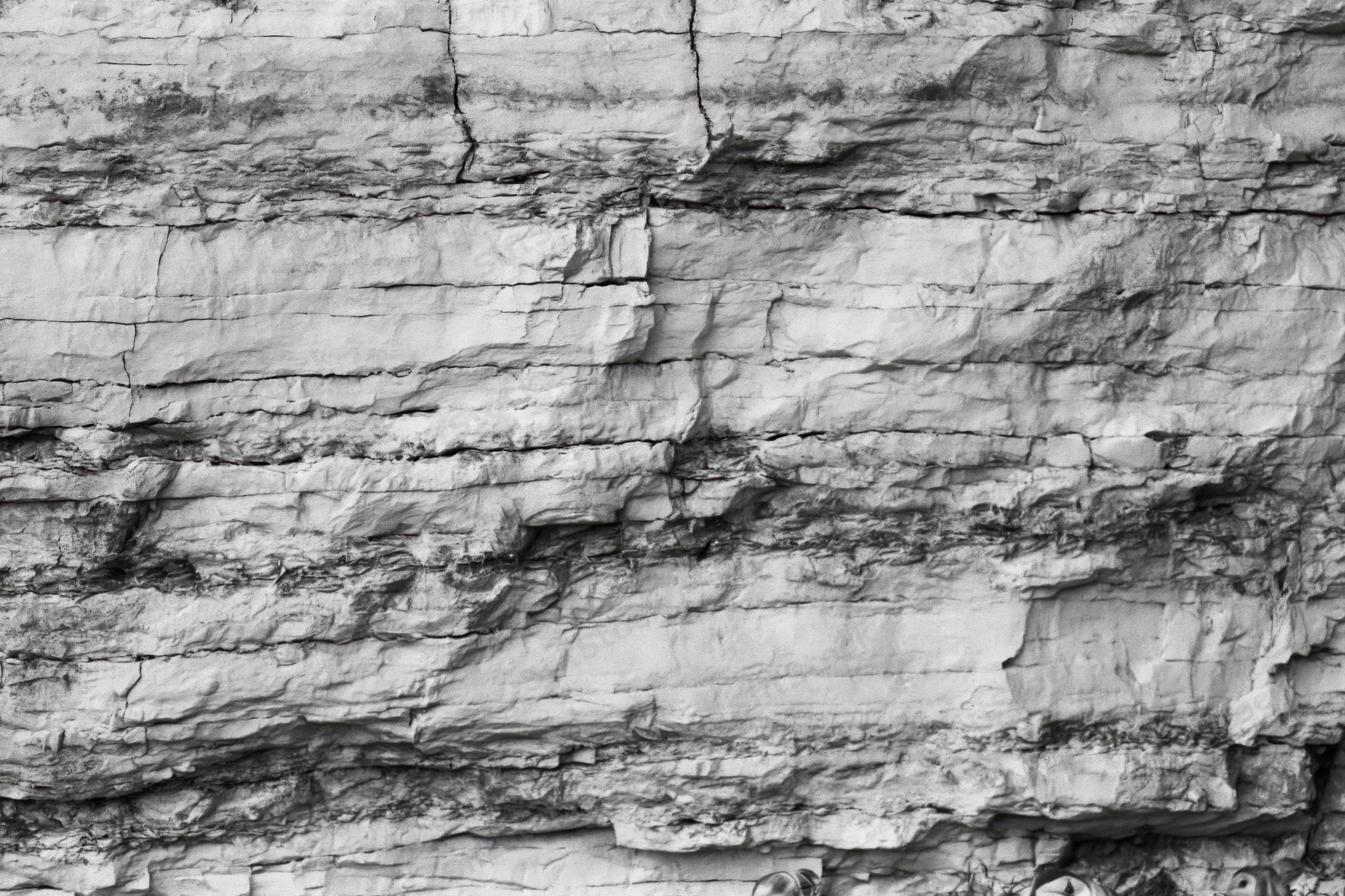 Close-up of layered sedimentary rock face showing strata and natural texture