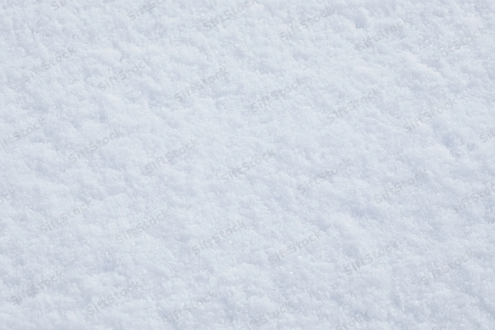 Closeup of freshly packed snow covering the ground in winter