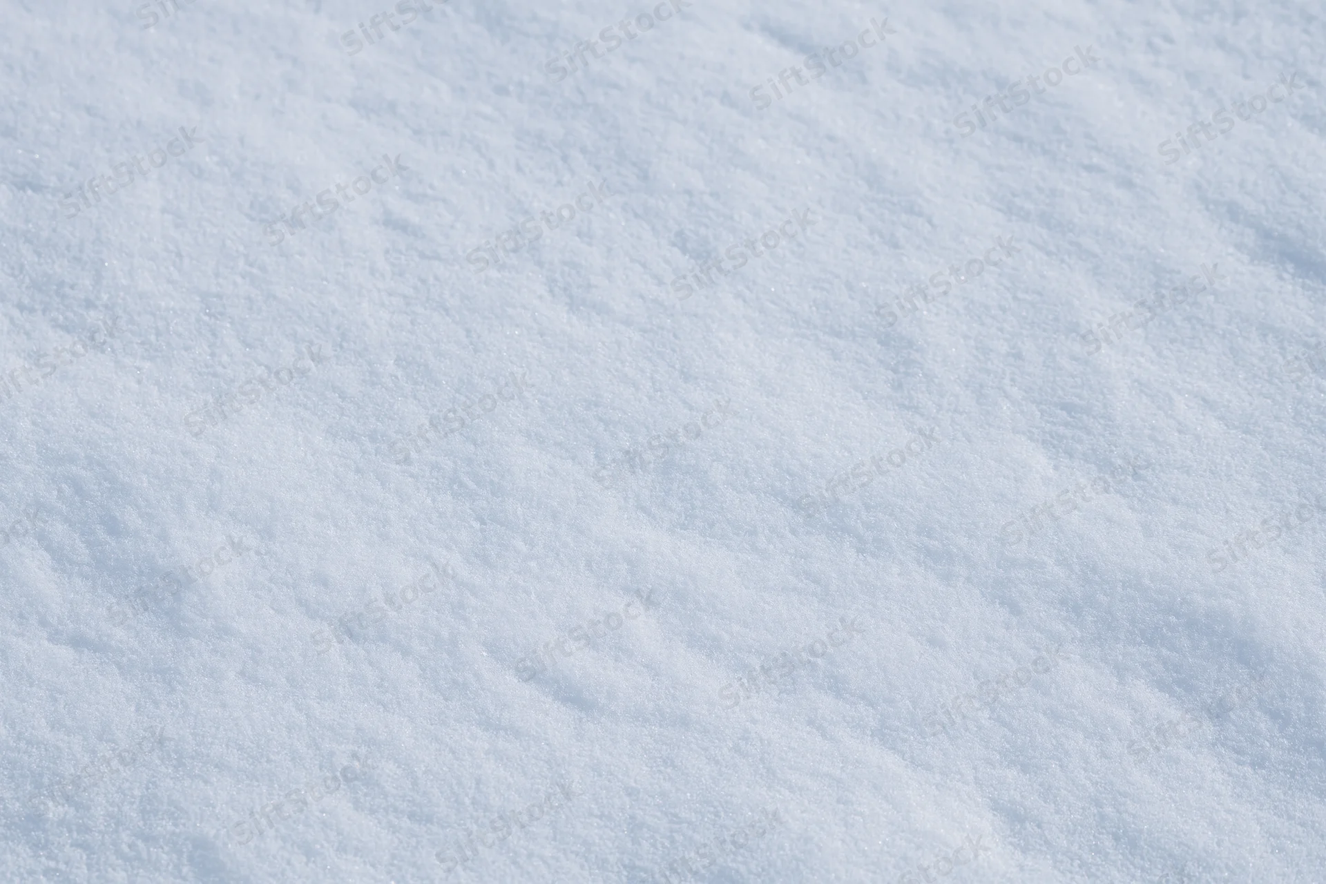 Close-up of freshly packed snow covering the ground in winter
