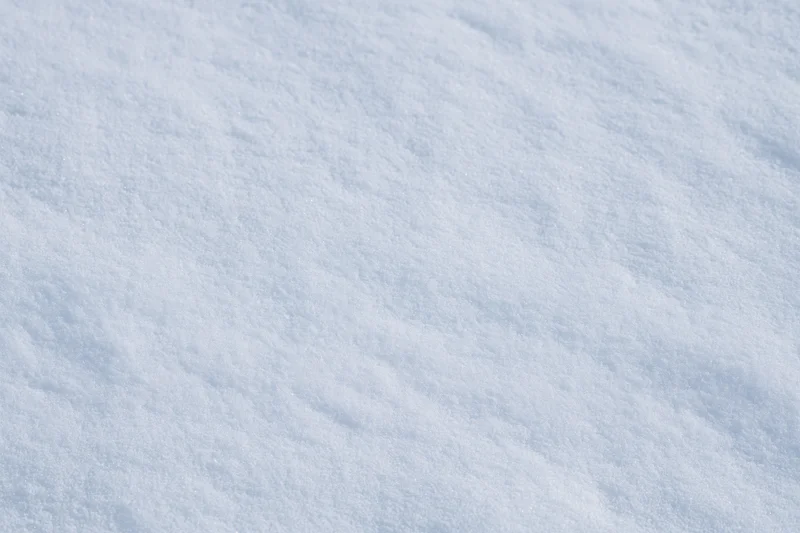 Close-up of freshly packed snow covering the ground in winter