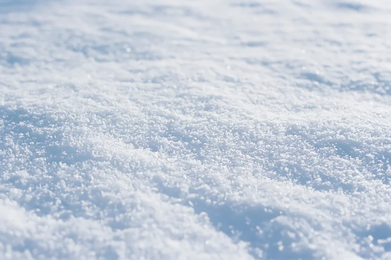 Close-up of fresh undisturbed snow surface on the ground