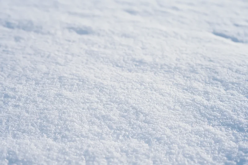 Close-up of fresh undisturbed snow surface at ground level