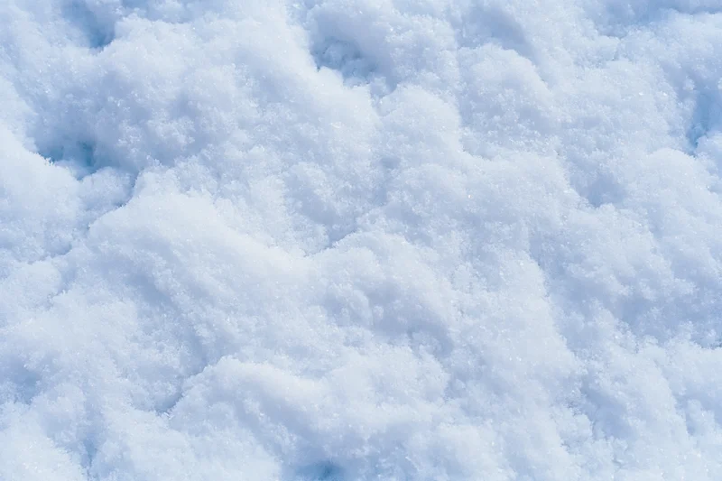 Close-up of fresh snow surface filling the frame