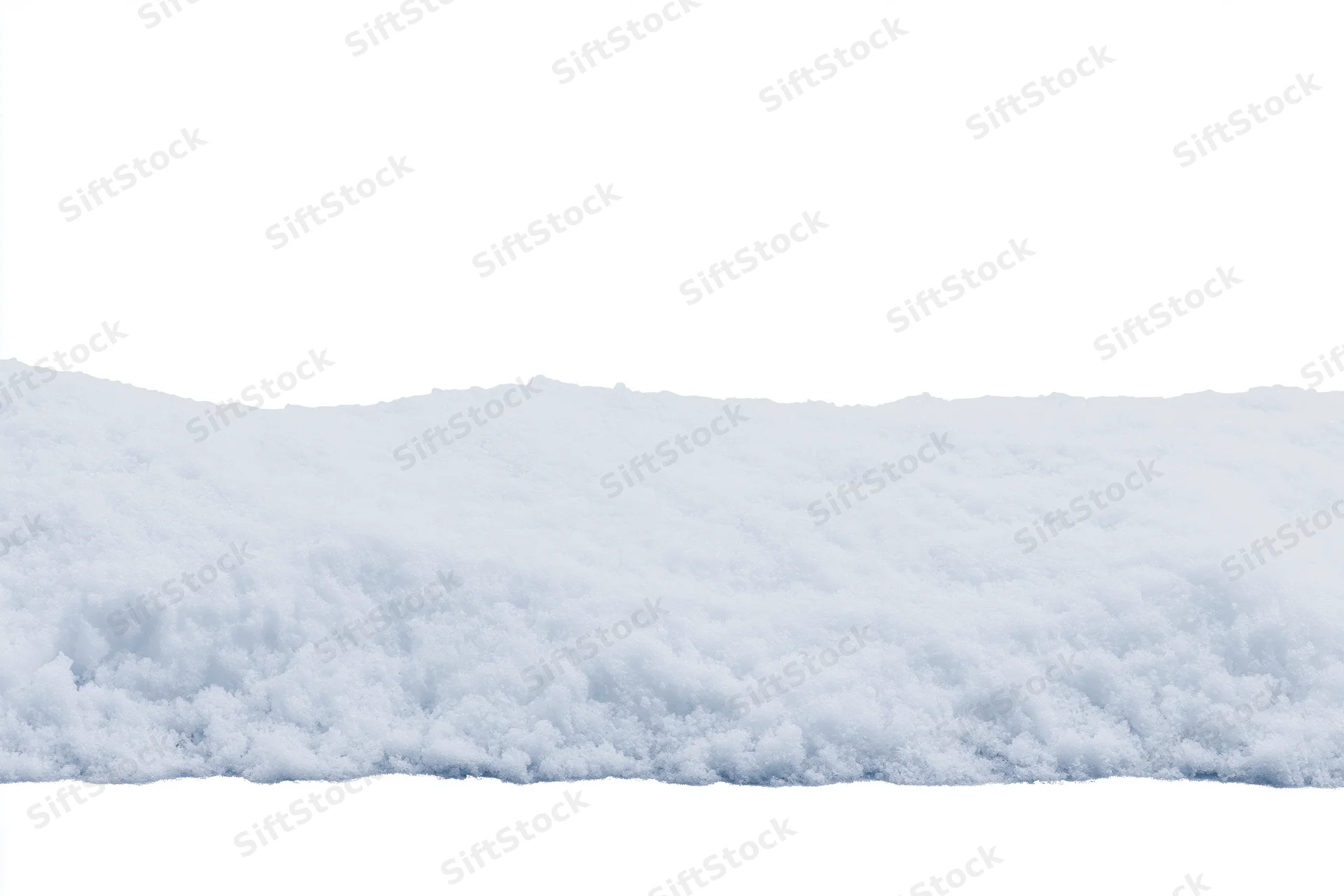 Close-up of a snow drift edge running horizontally across the frame with white background above and below