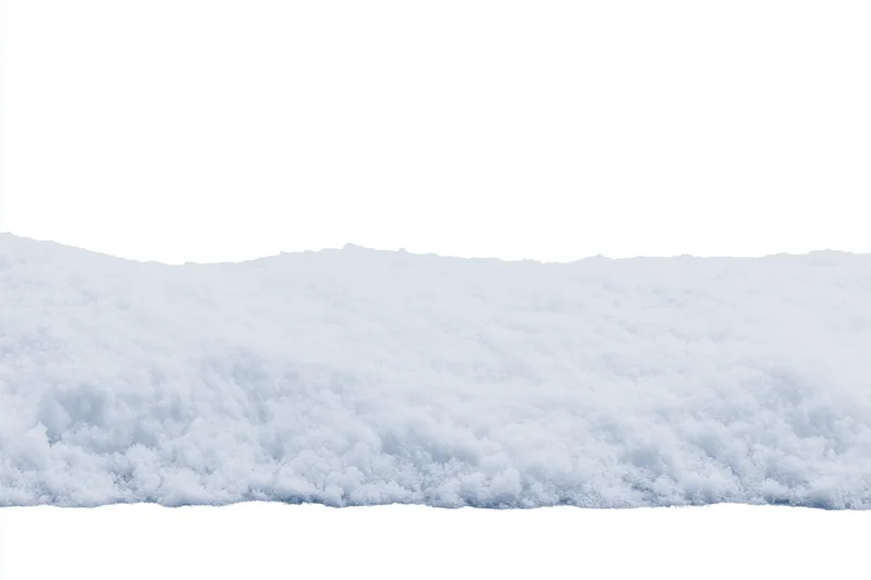Close-up of a snow drift edge running horizontally across the frame with white background above and below