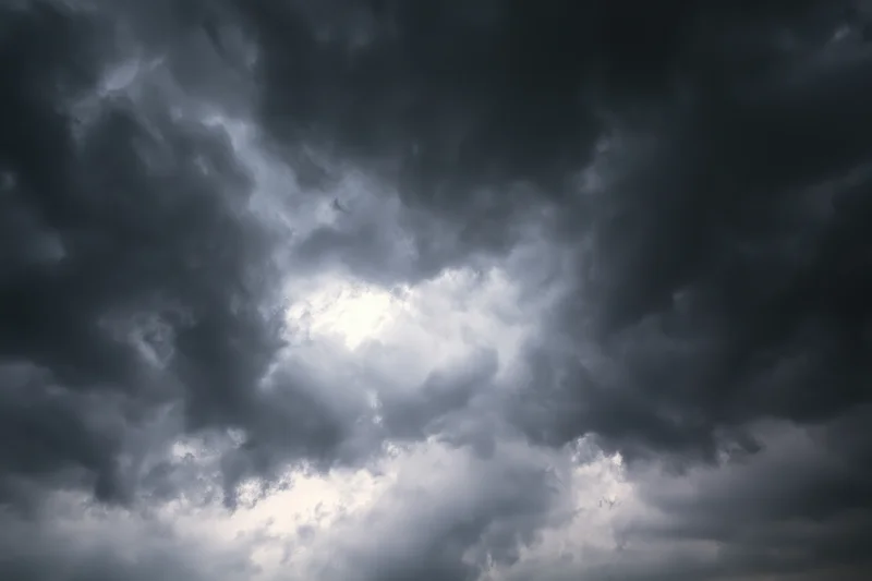 Dark storm clouds filling the sky with heavy cumulonimbus formations