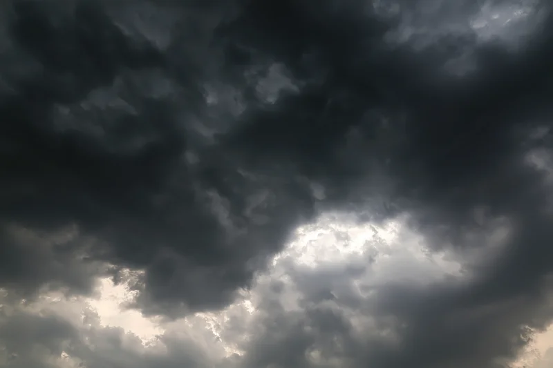 Dark storm clouds filling the sky with heavy cumulonimbus formations