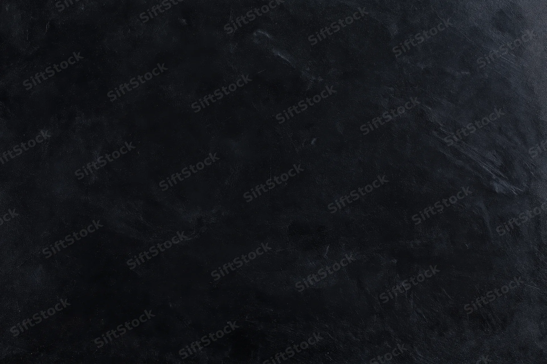 Dark weathered concrete wall surface with textured rough finish filling the frame