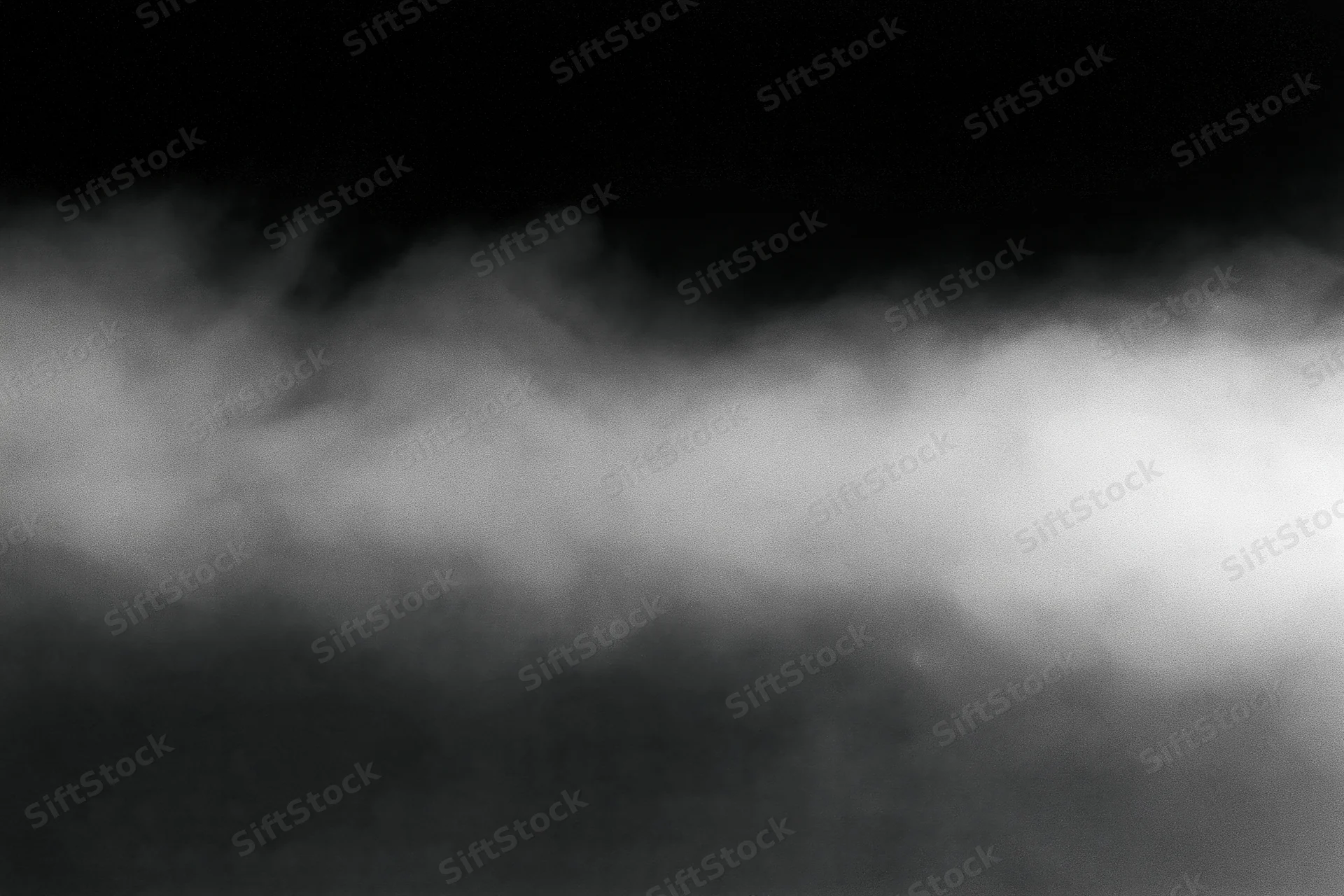 Dense white fog rolling horizontally across the frame forming a soft atmospheric layer