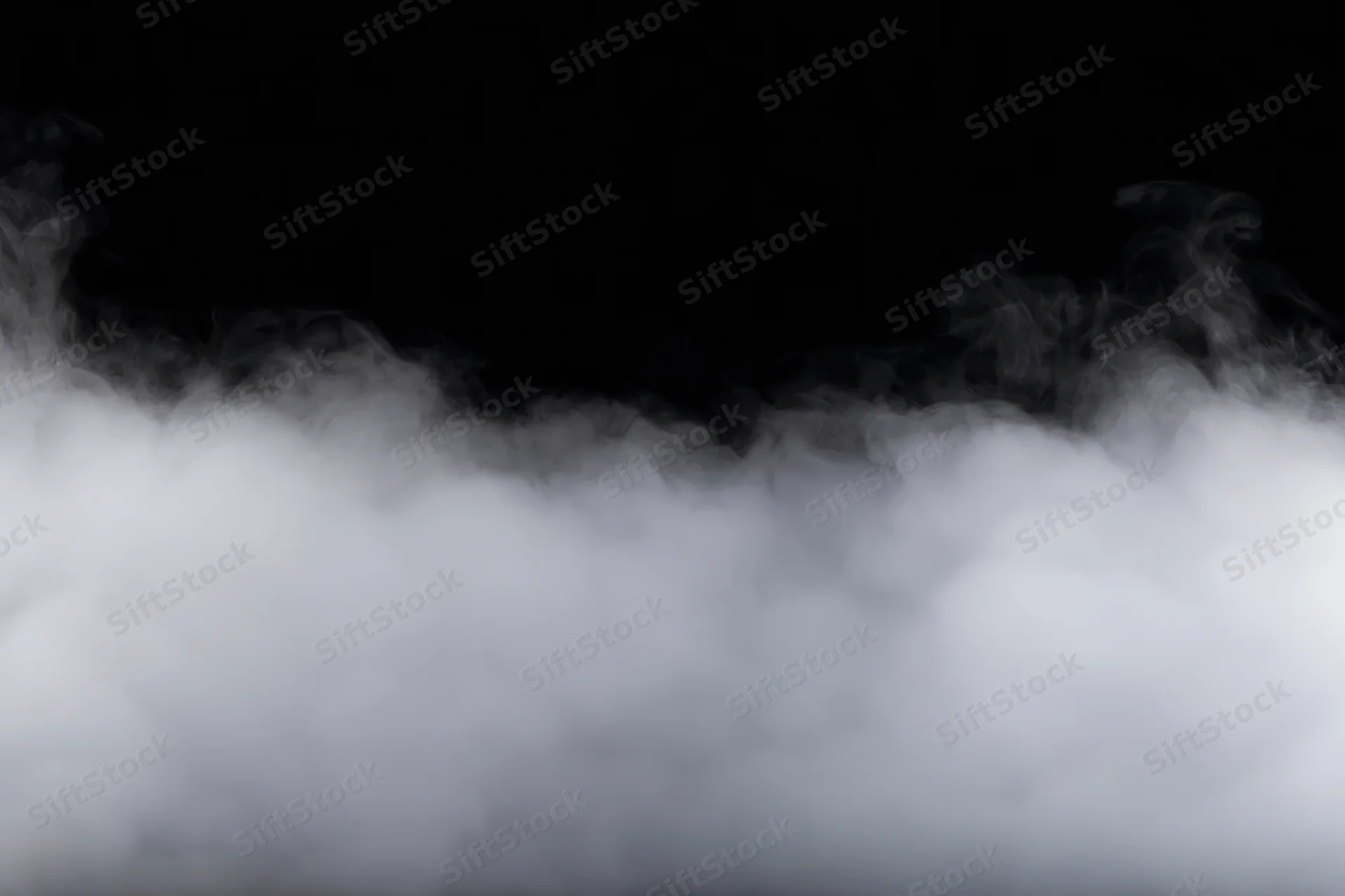Dense white smoke drifting horizontally across black background