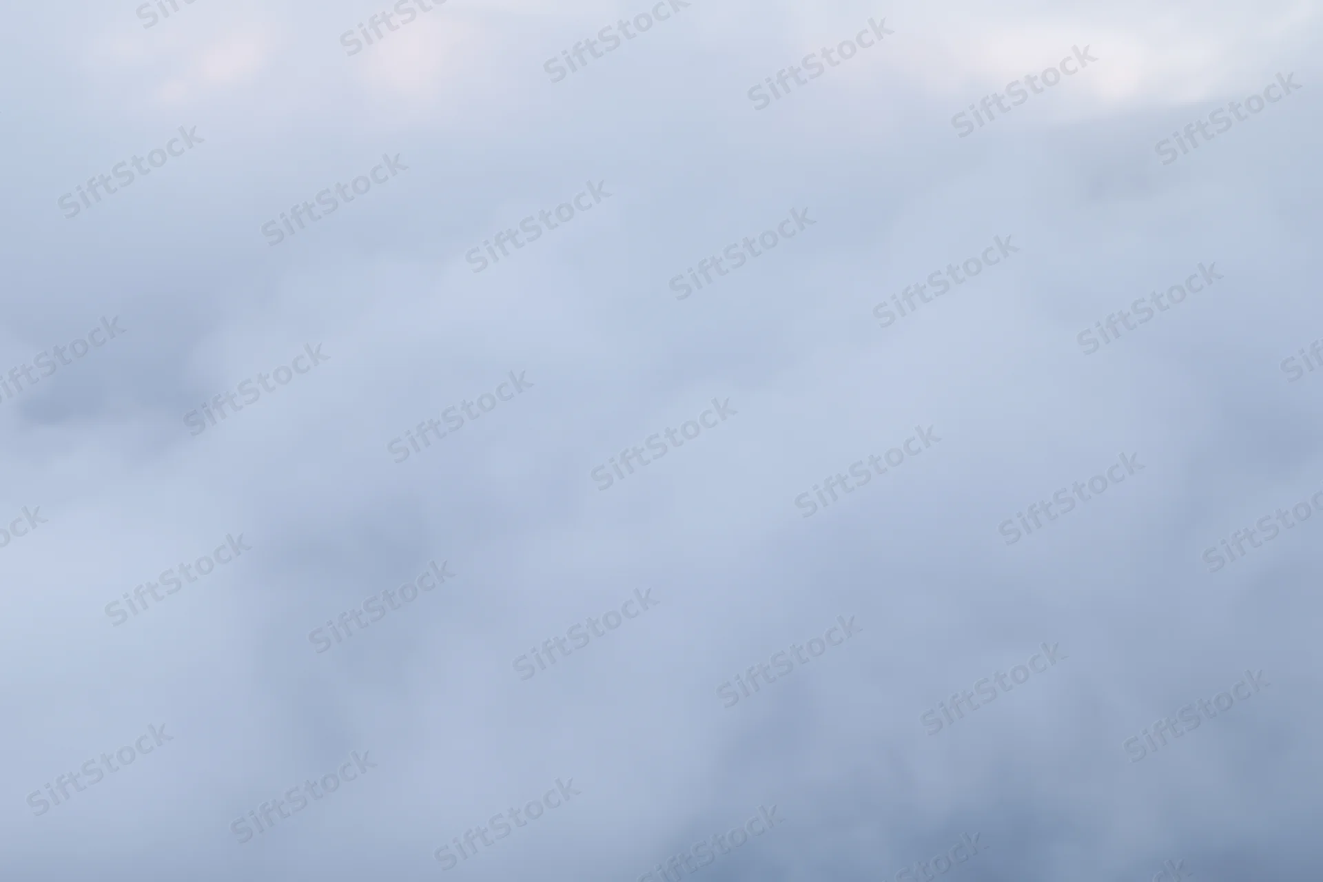 Dense white steam billowing across a flat surface filling the frame