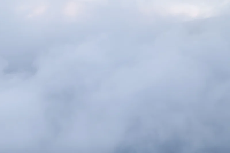 Dense white steam billowing across a flat surface filling the frame
