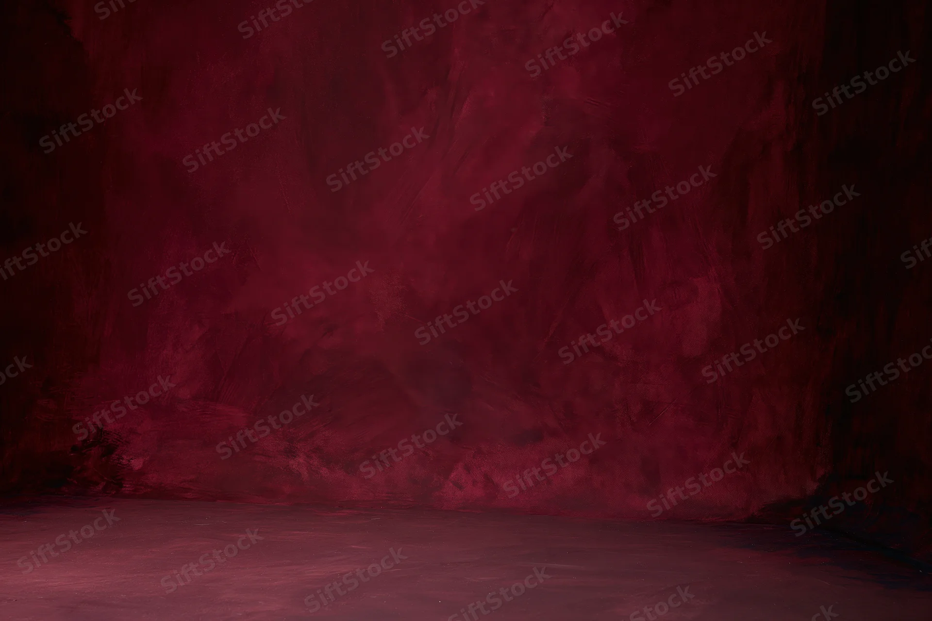 Textured red painted canvas wall in empty photography studio interior