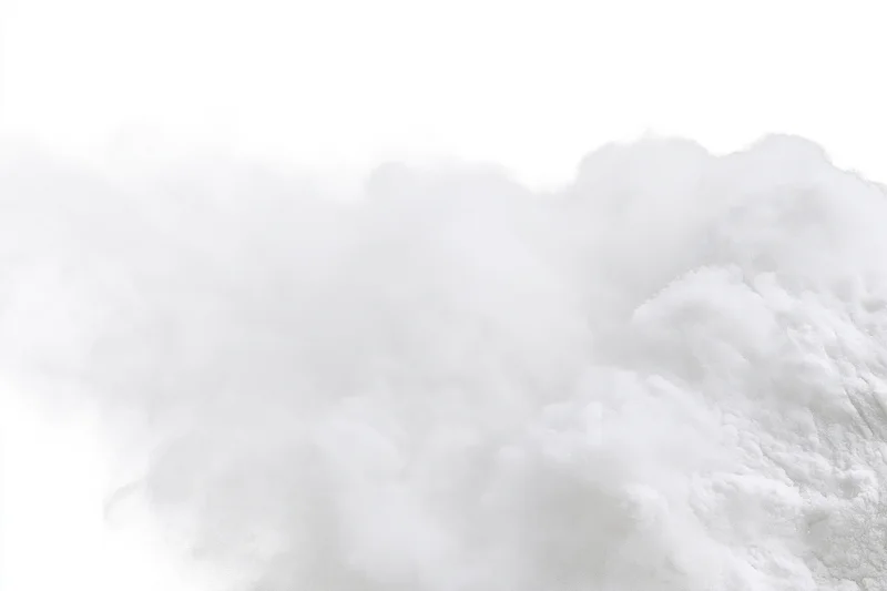 White powder exploding midair against pure white background