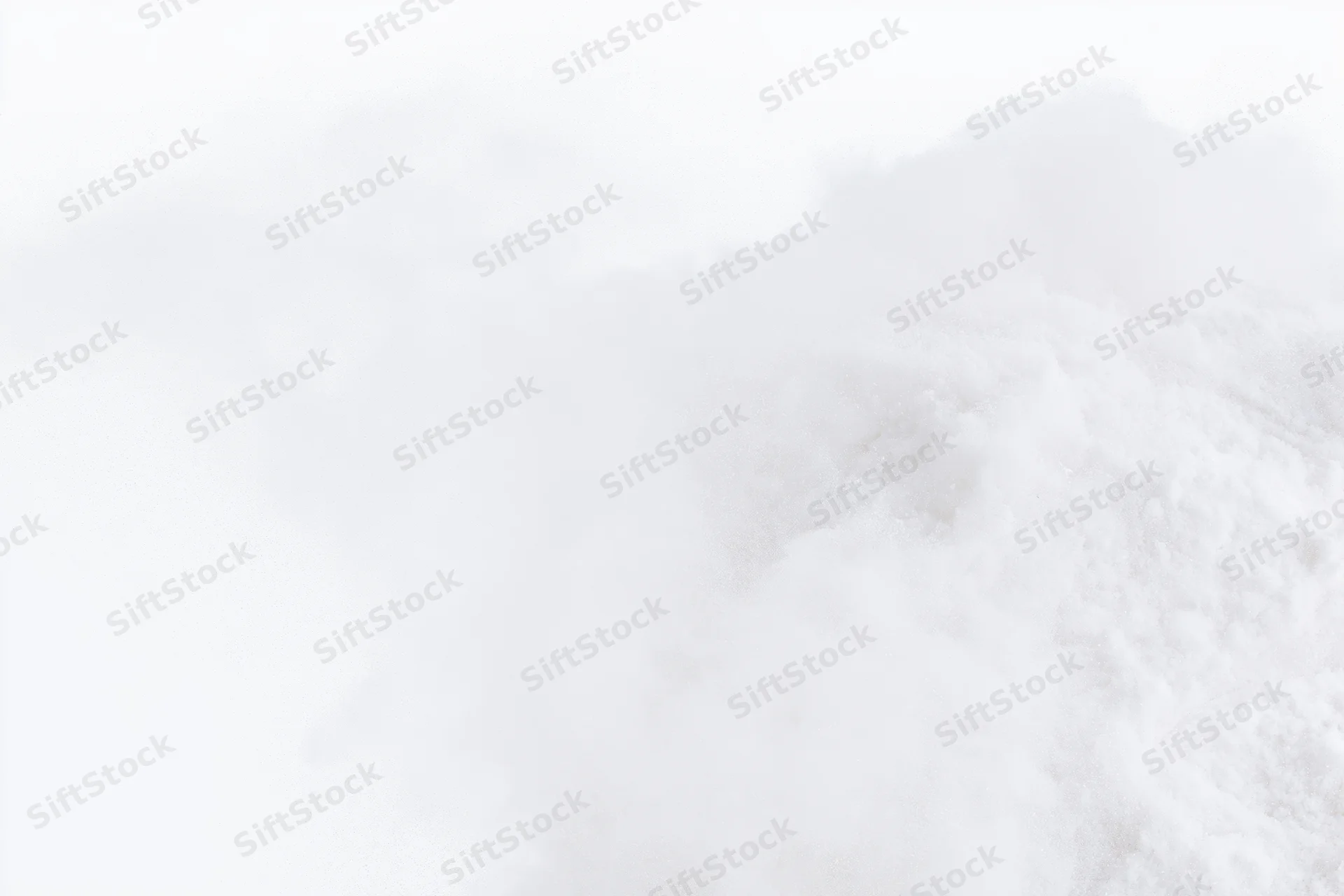 Fine white powder exploding midair against pure white background