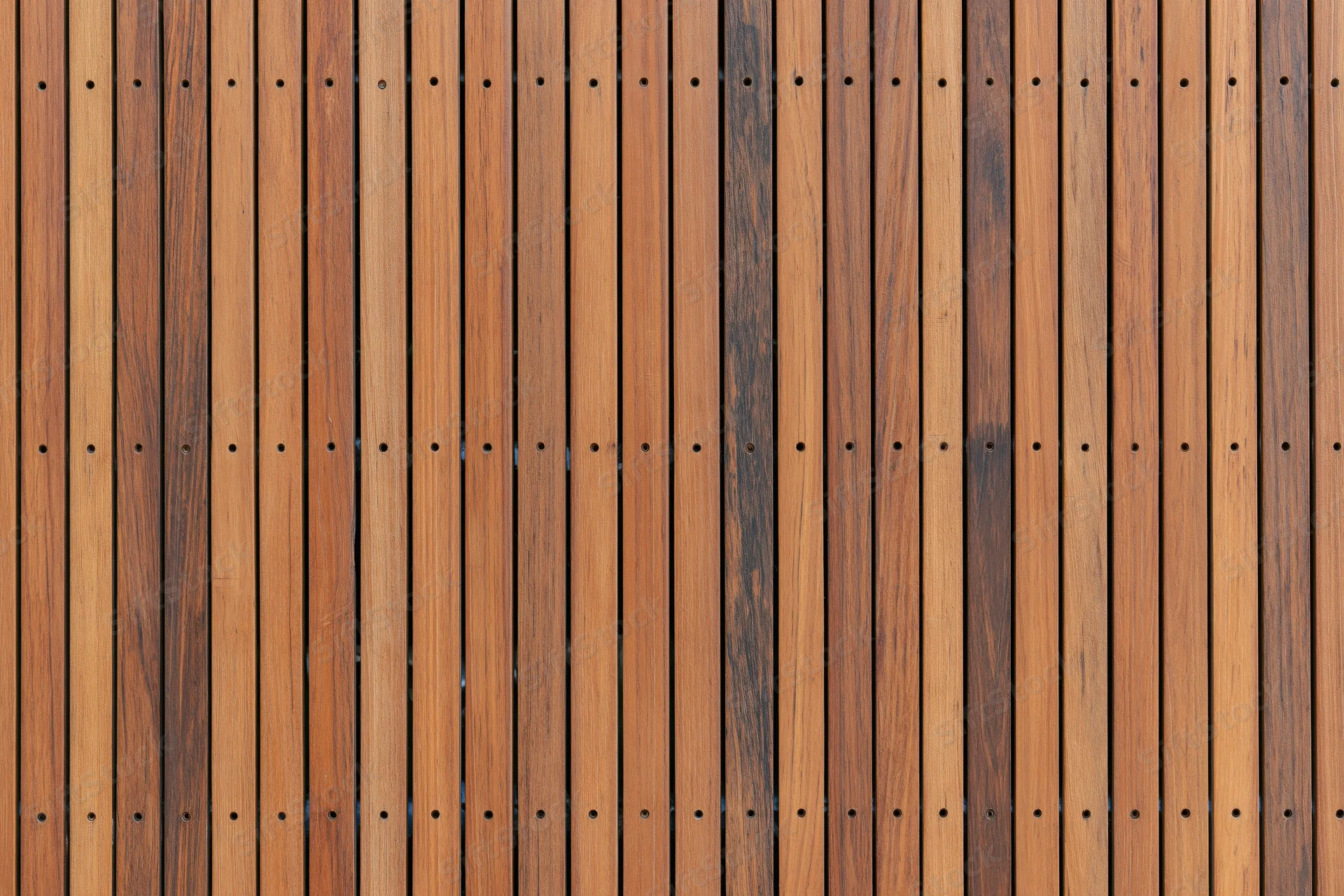 Vertical wooden slats arranged tightly in a flat surface