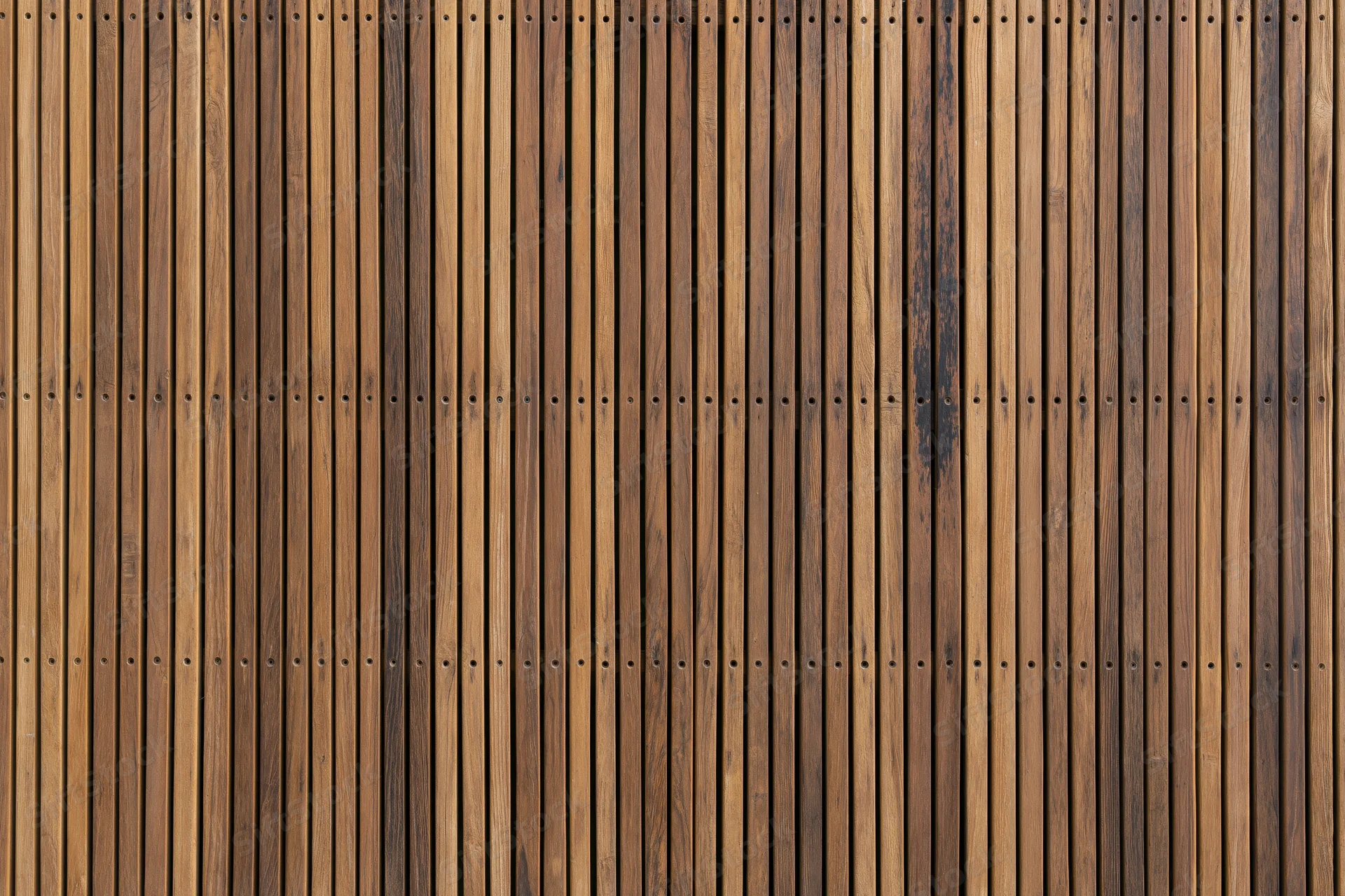 Vertical wooden slats arranged tightly as a flat textured surface