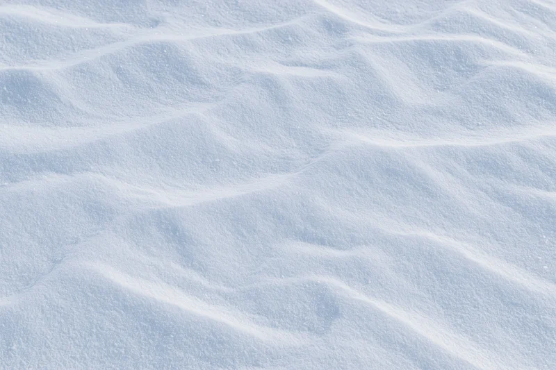 Undisturbed snow surface with gentle waves covering the frame
