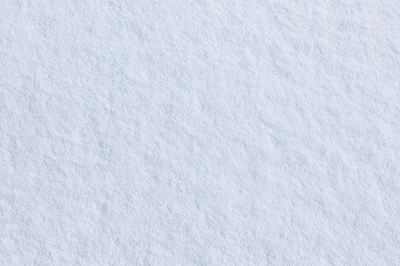 Flat undisturbed snow surface filling the frame