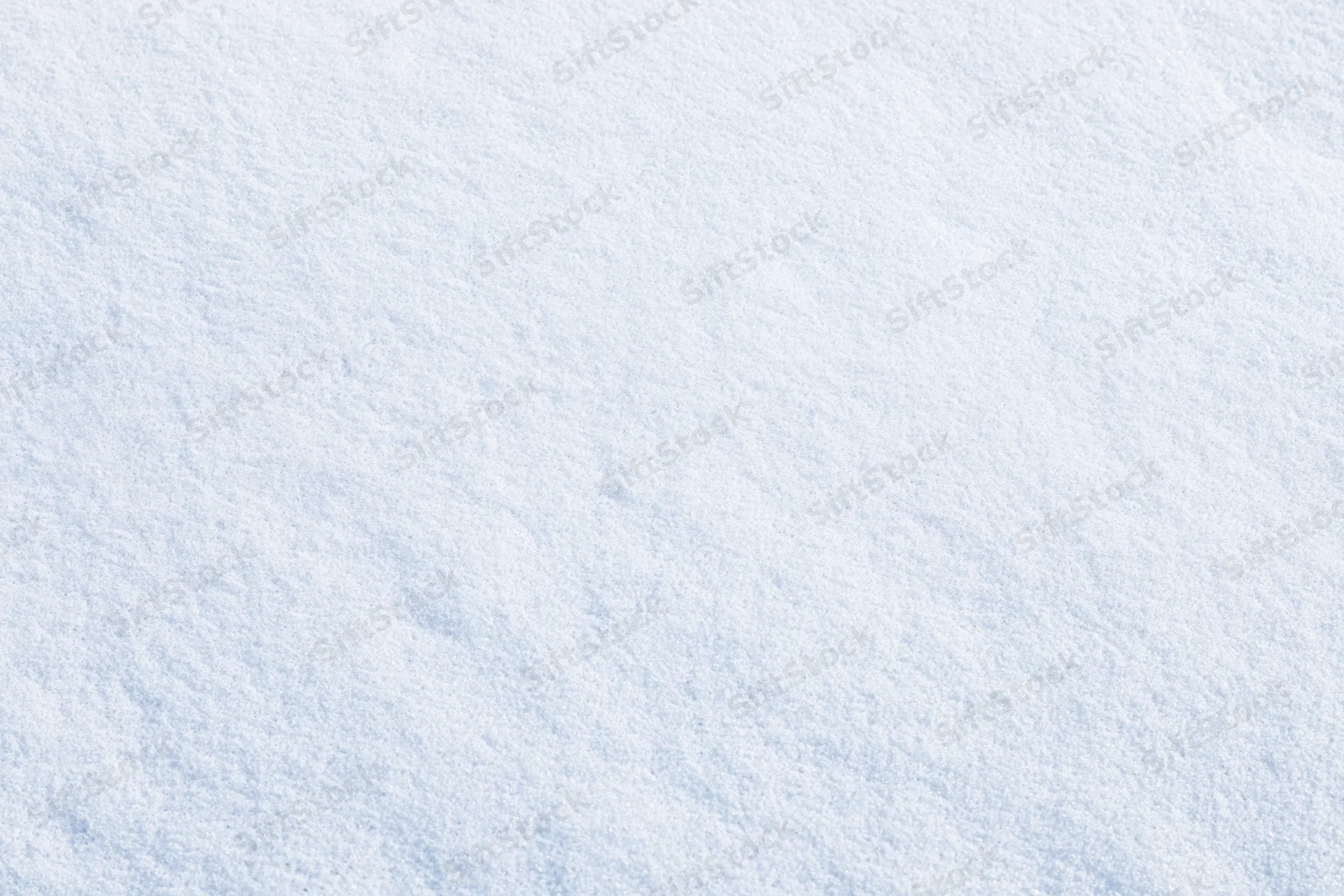 Flat undisturbed snow surface filling the frame