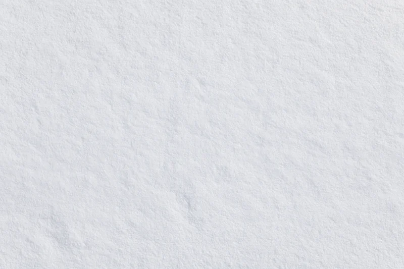 Flat undisturbed snow surface filling the frame