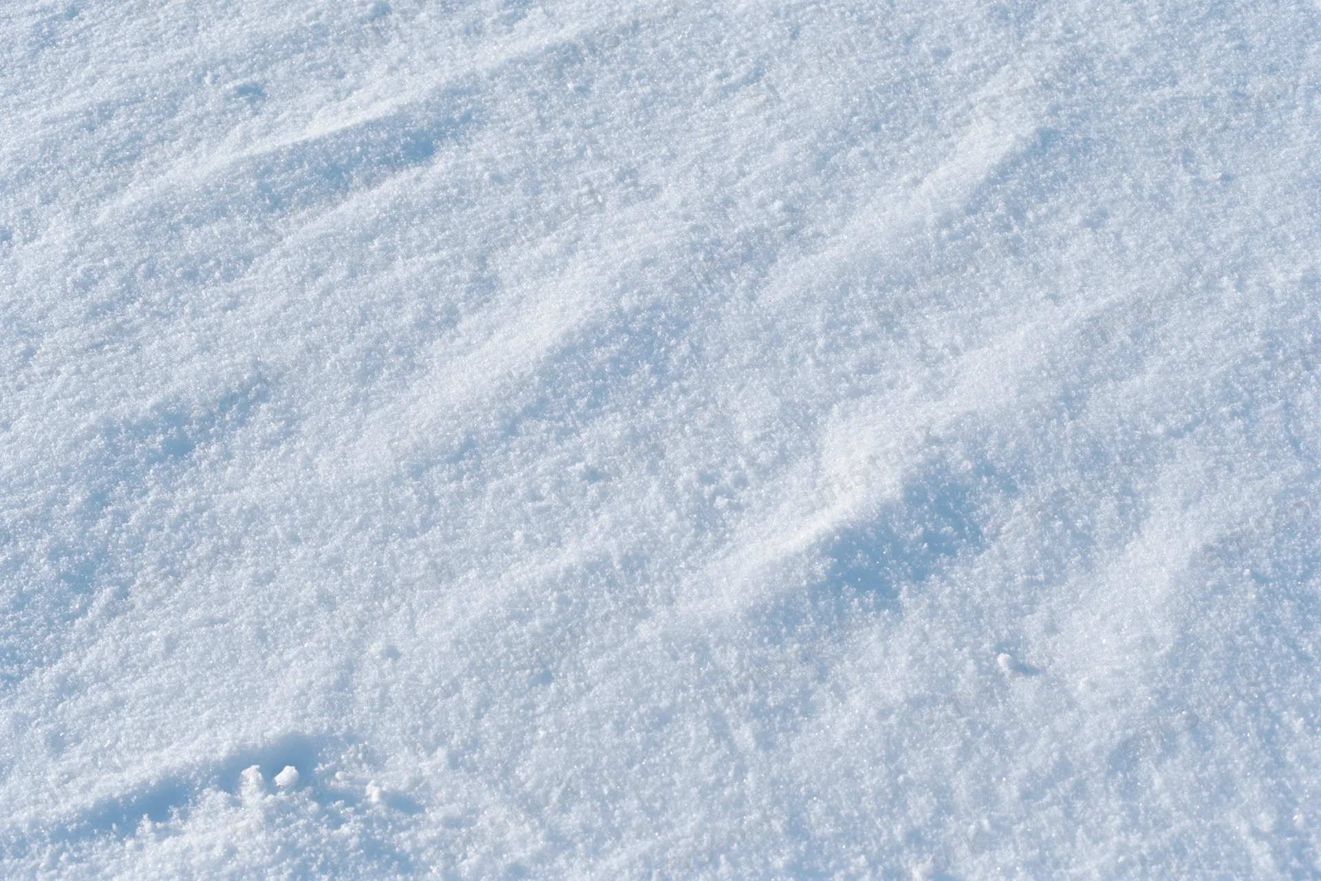 Closeup of undisturbed snow surface covering the ground in winter