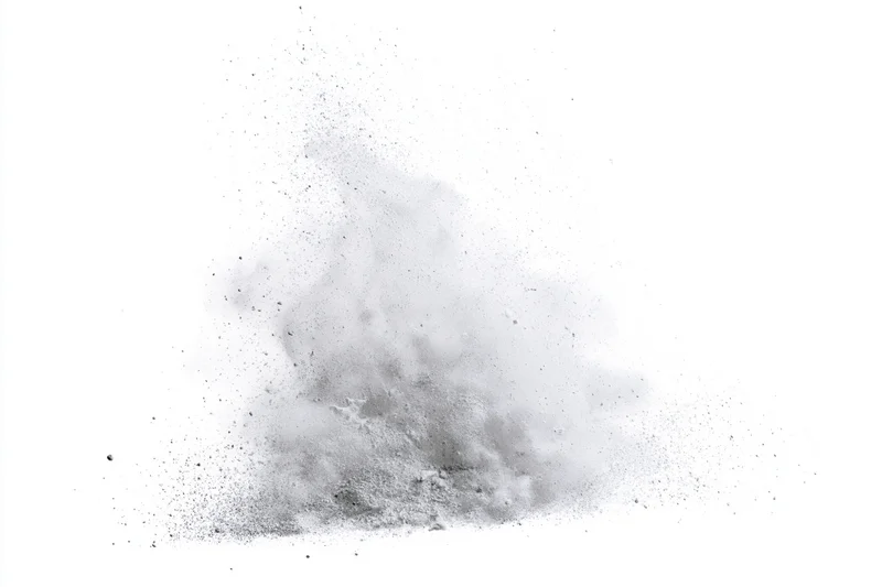 Gray powder exploding in mid-air frozen in motion against white background