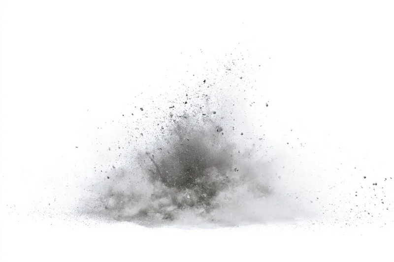 Gray powder exploding in midair frozen in motion against white background