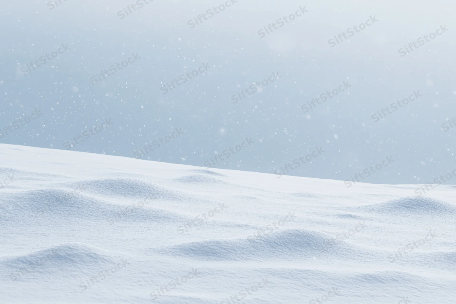 Snow-covered field under heavy snowfall with overcast sky