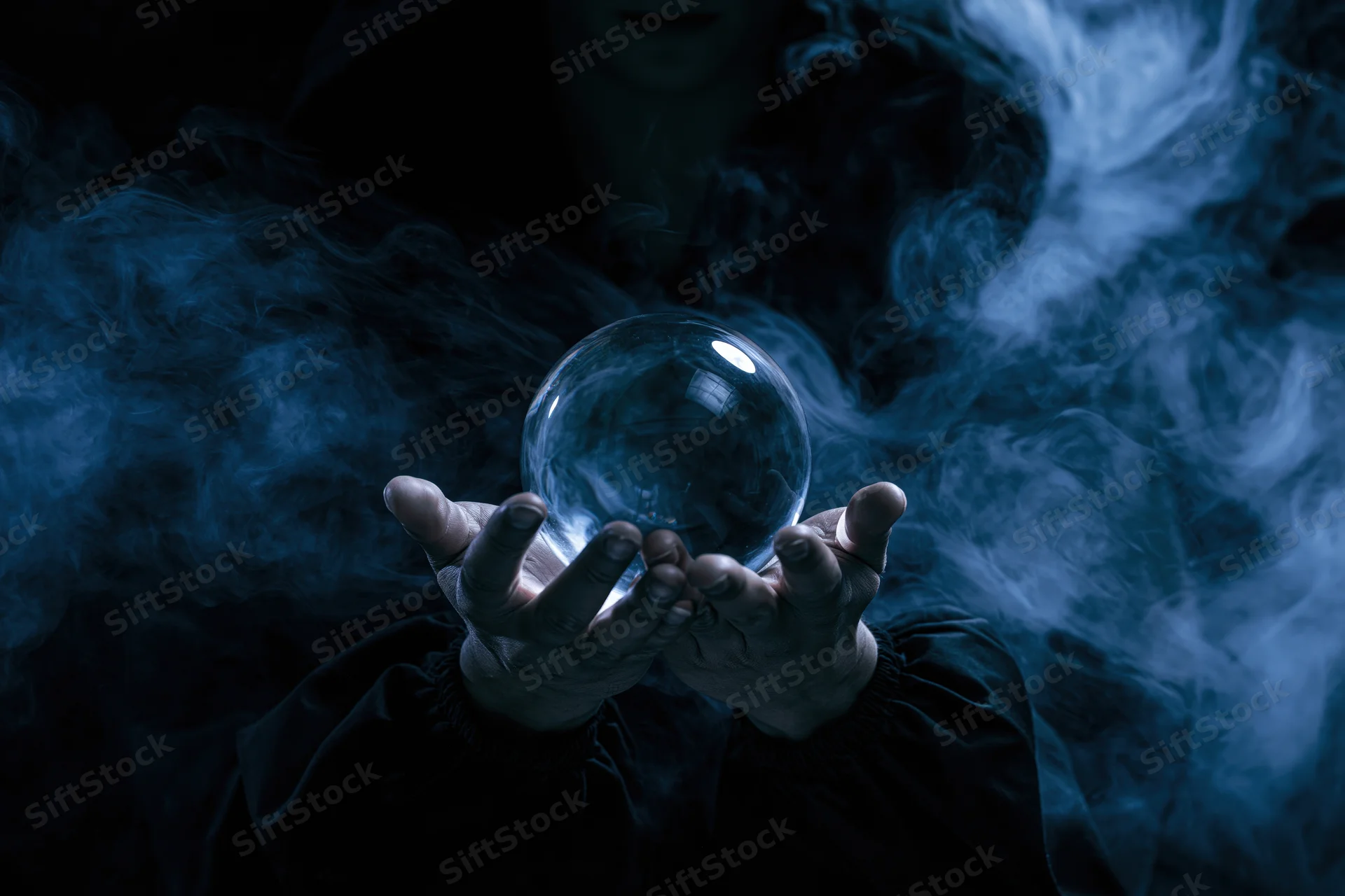 Woman holding a crystal ball in dark smoke, hooded and cloaked, hands cupped around the sphere