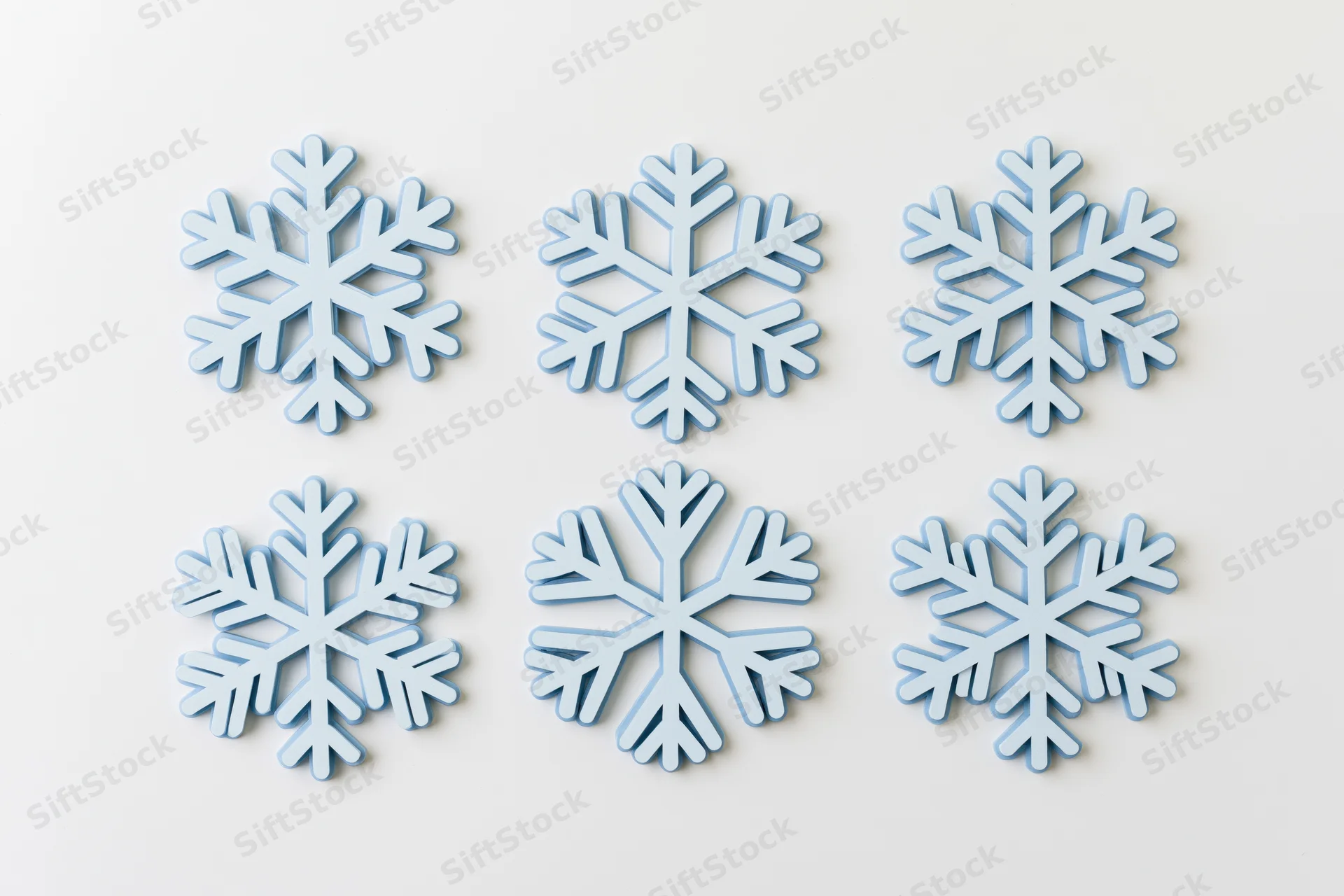 Six flat blue snowflake icons arranged in two rows on a white background
