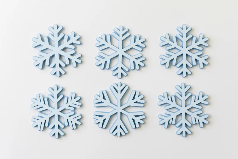Six flat blue snowflake icons arranged in two rows on a white background