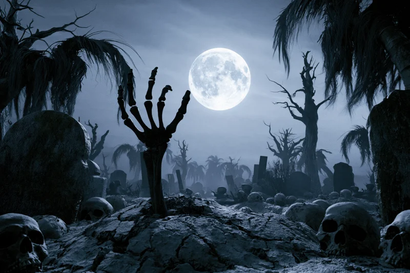 Skeletal hand rising from cracked earth in an abandoned graveyard under a full moon