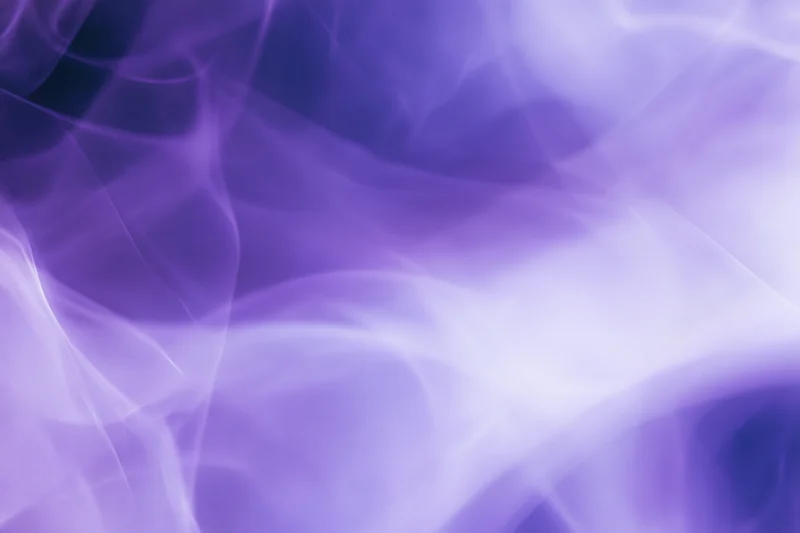 Translucent purple smoke drifting in soft waves across the frame