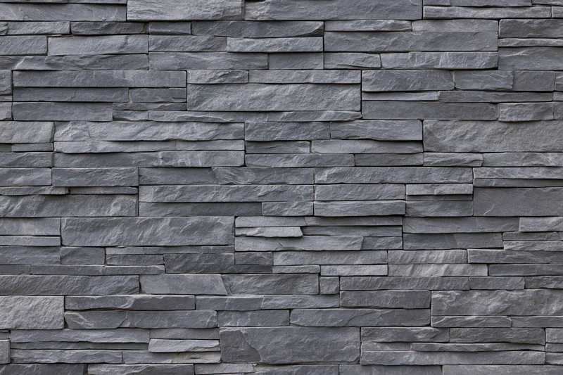 Stacked slate stone wall panel filling the frame