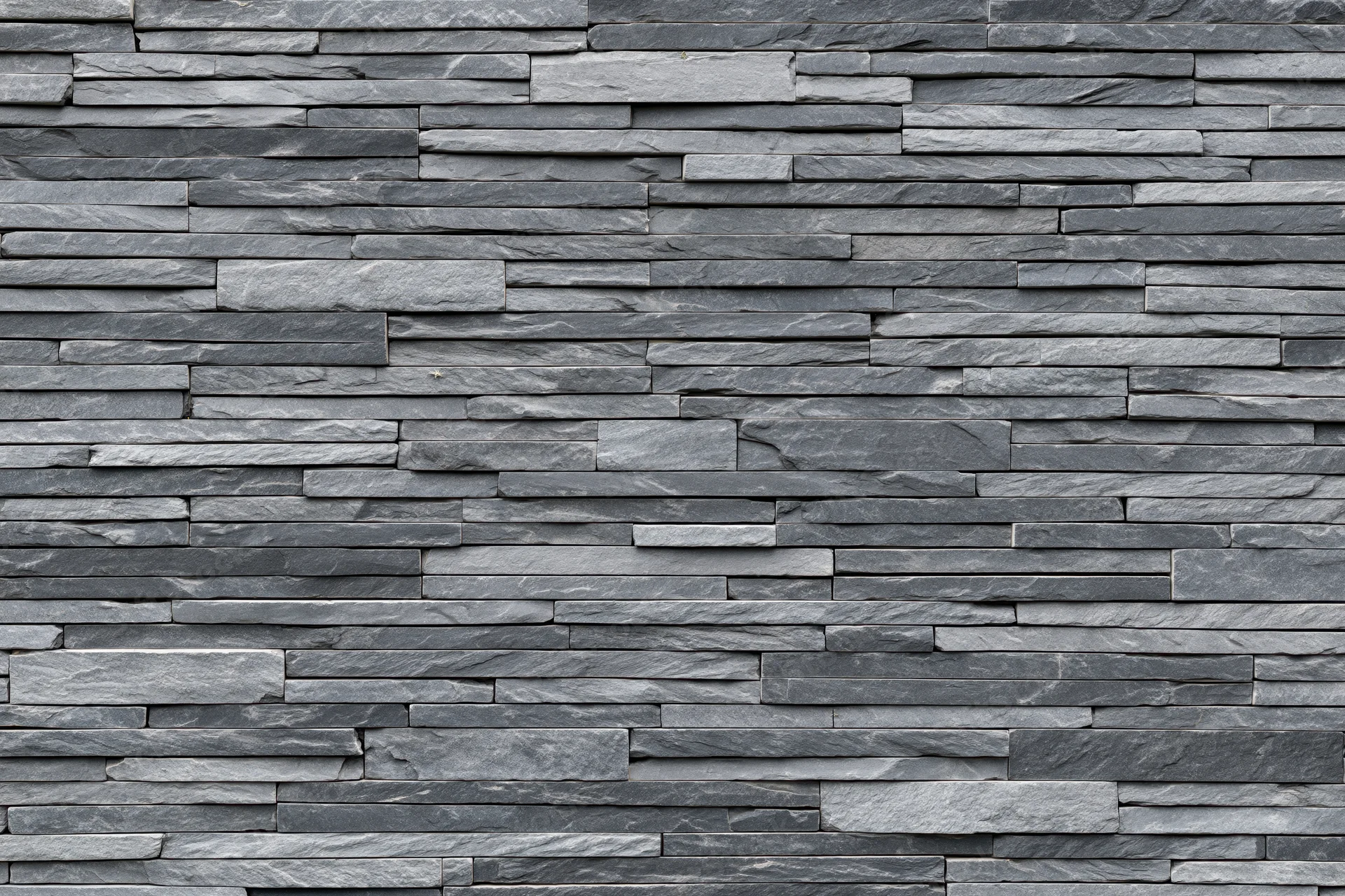 Stacked slate stone wall panel filling the frame