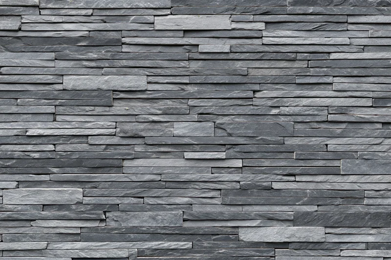 Stacked slate stone wall panel filling the frame